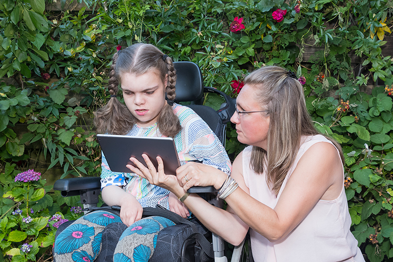 development skills teacher with student on ipad
