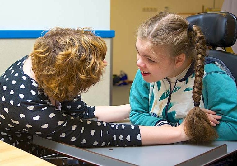 teacher speaking with student